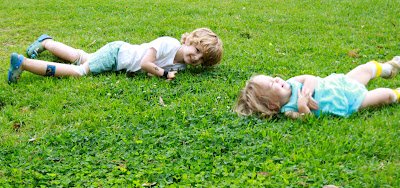 kids rolling down hill